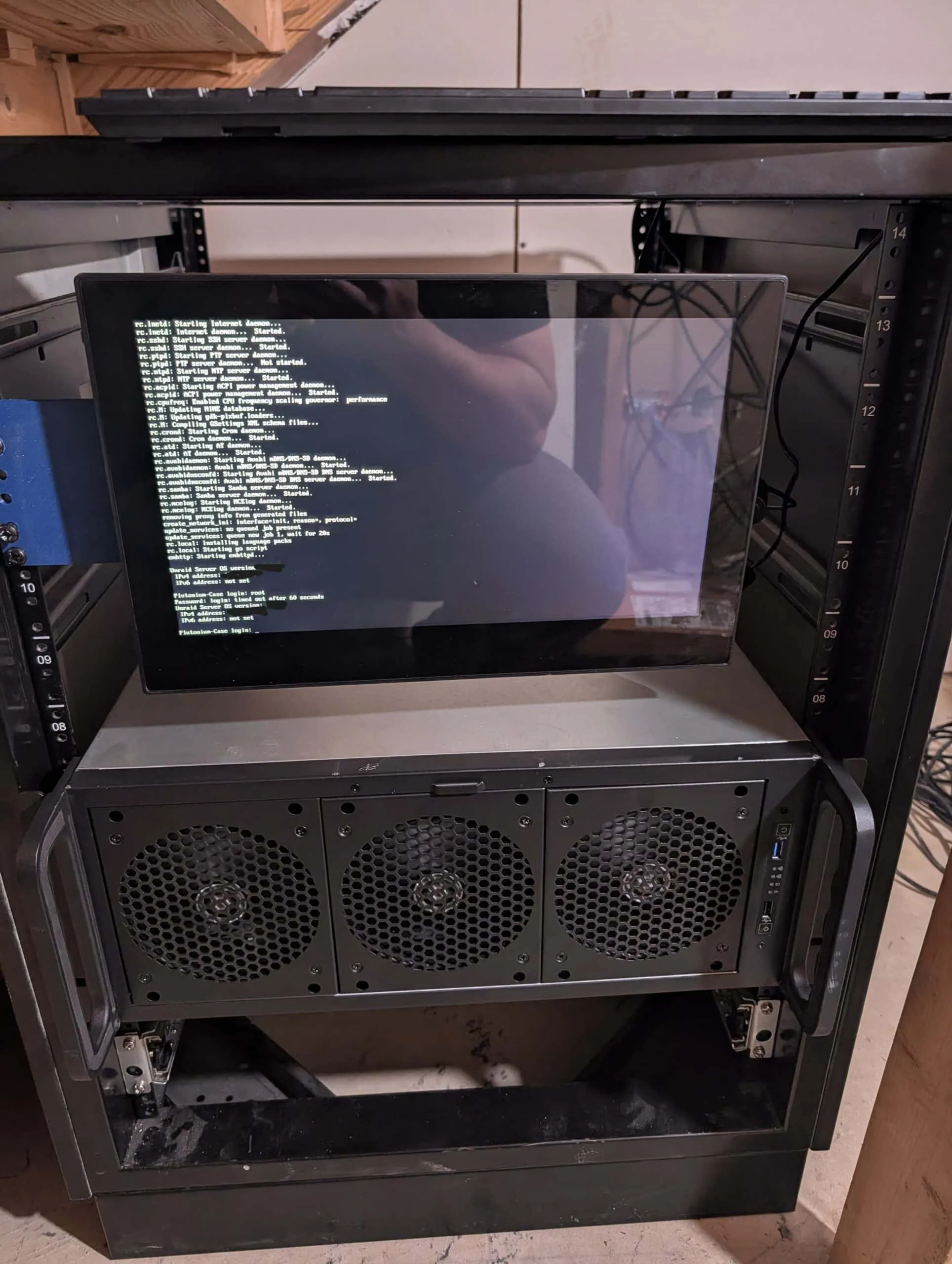 Front of the rack with the monitor on its printed bracket above the new 4U server