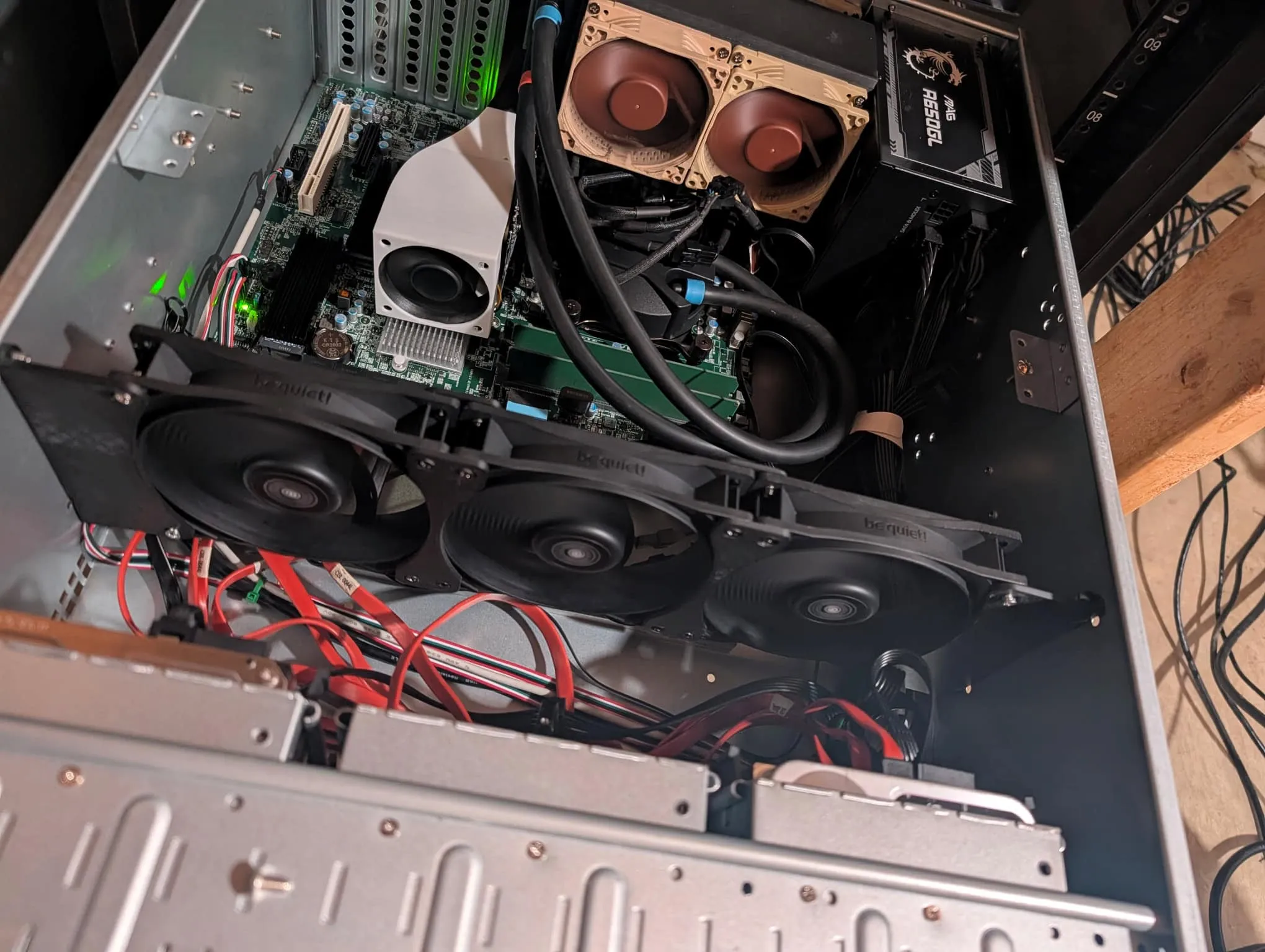Inside the new 4U Rosewill server: Supermicro board, three be quiet! fans, and the small AIO radiator with two Noctua fans on its printed mount